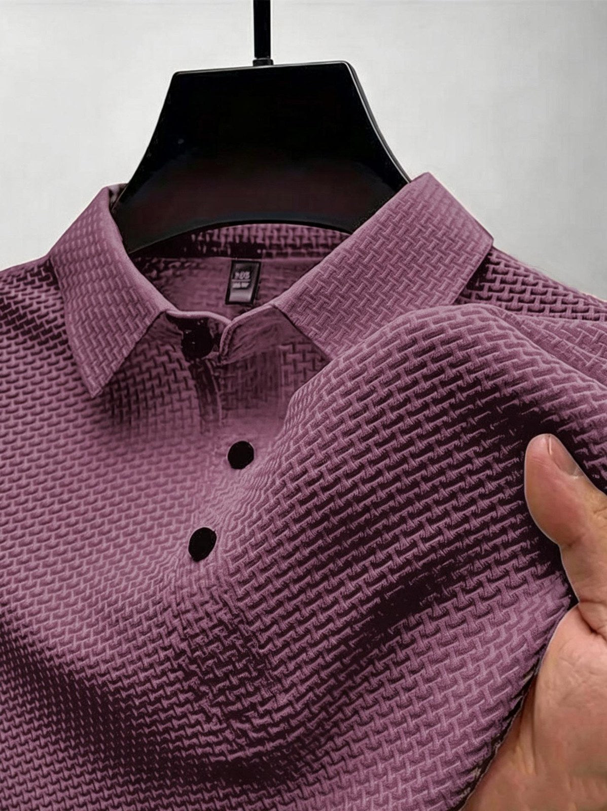 Everyday Polo in purple, close-up of the knit